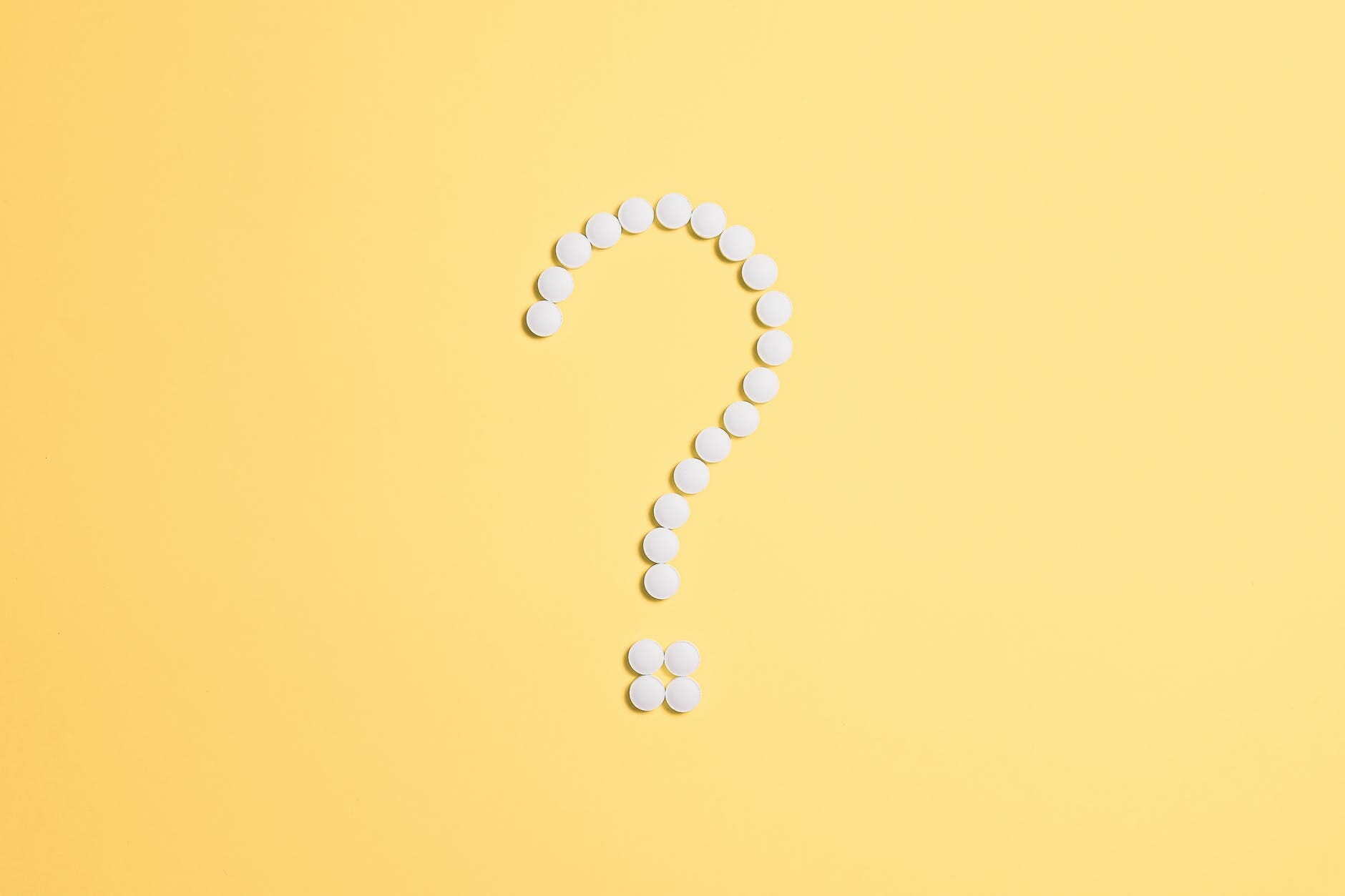 white beads on question mark sign